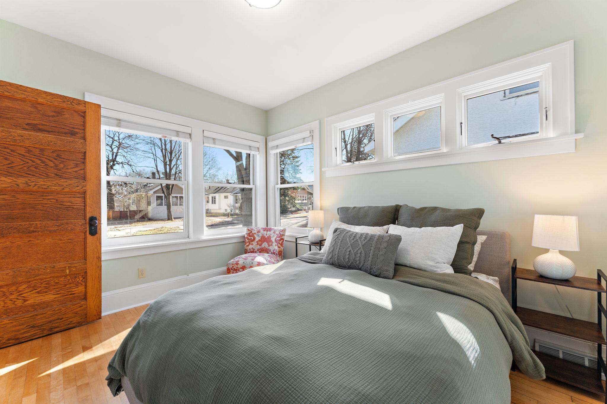 Main floor primary bedroom — so much natural light!