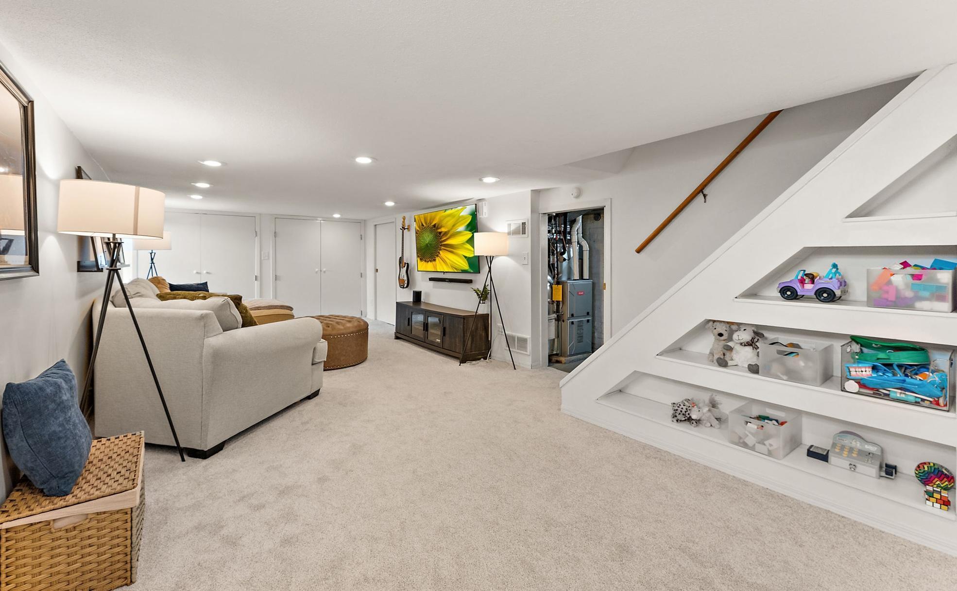 Family room downstairs. Built-in shelving to store your books or trinkets.