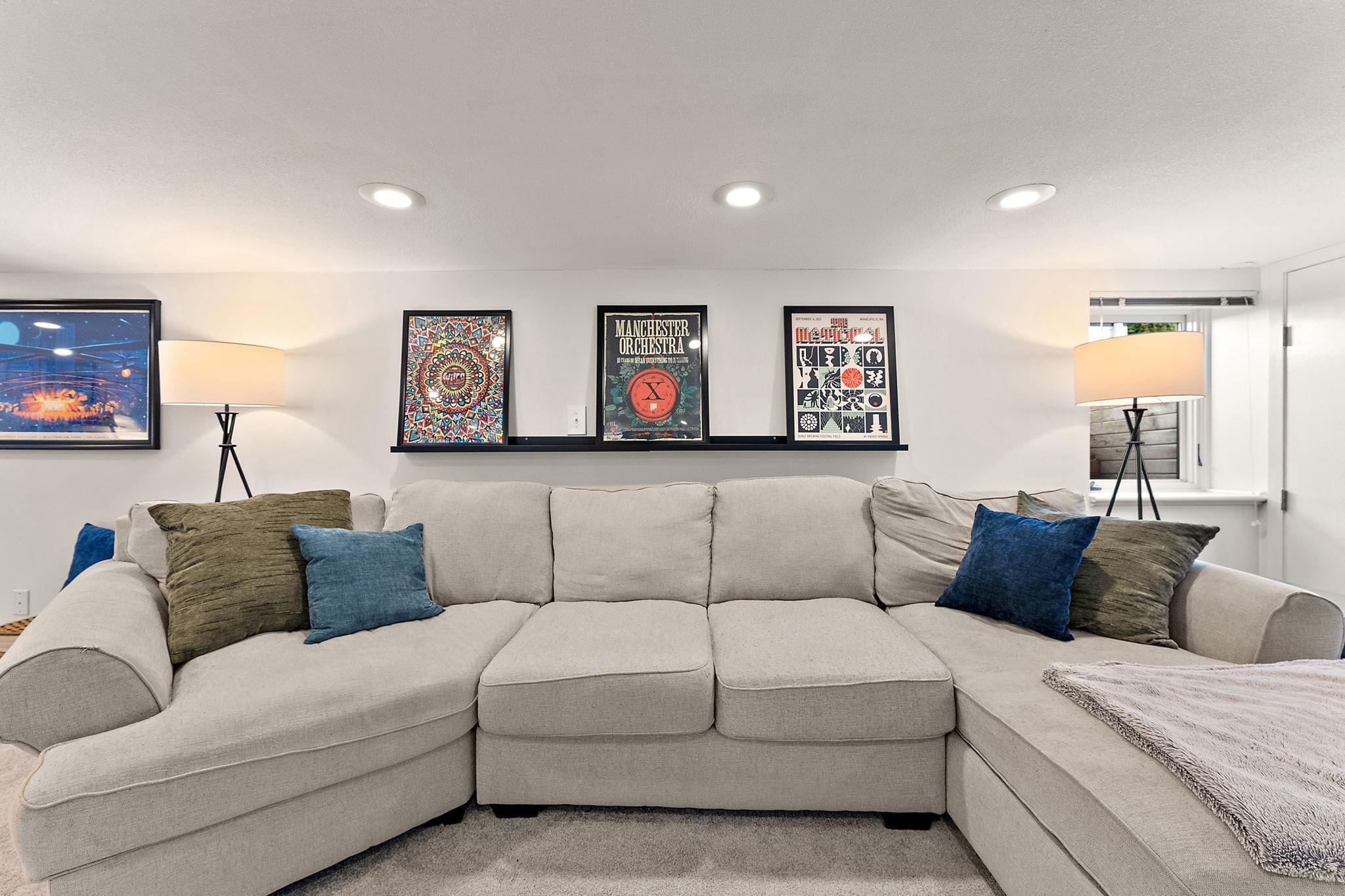 Room for a large sectional for watching movies or entertaining. Note the egress window in the corner — this could be another bedroom.