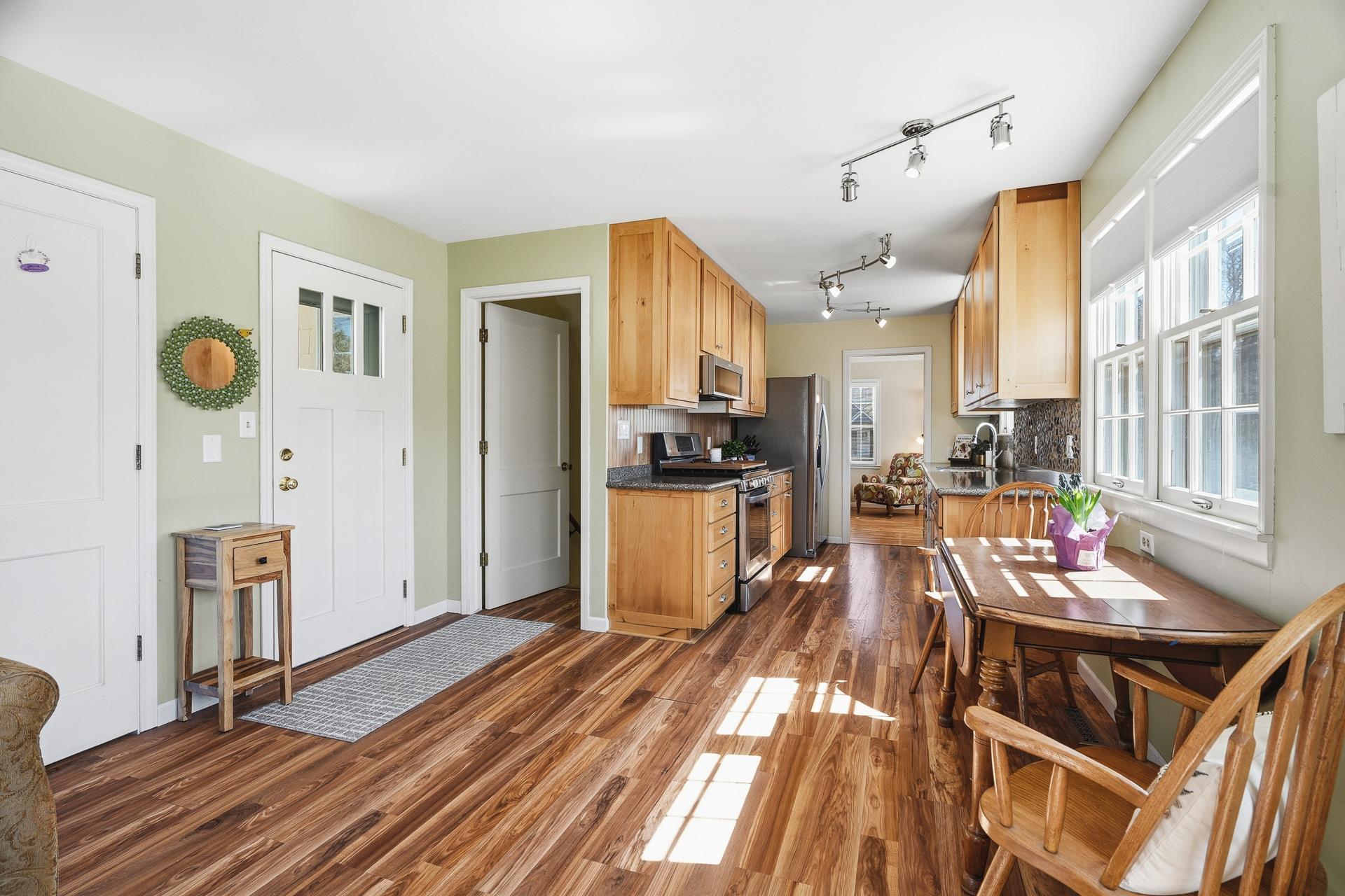 Back door leads to paver patio area. There is also the access to the lower level from this room.