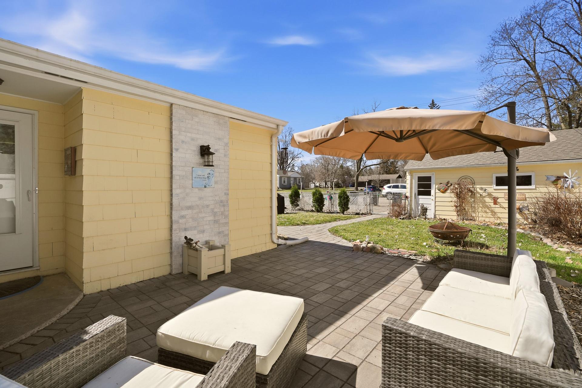 Paver pathway leads to the garage for easy access.