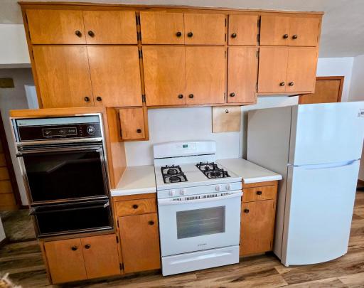 Seller installed new gas stove and refrigerator in 2024. Left the built in oven- great to have that extra oven space when you have big dinners or are busy baking.