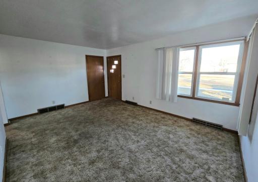Front door access and attractive corner windows