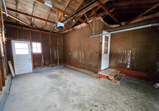 Door to back yard and door entrance to dining room