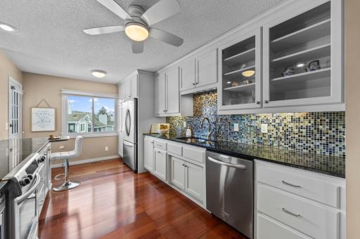 Stainless appliances, abundant cabinetry and beautiful floors.