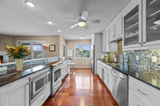 The opened kitchen looks out on the living room, while another door leads to the patio.