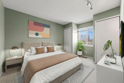 The second bedroom has two closets! (pleasee note the bedroom is virtually staged.)