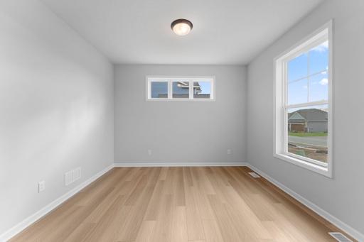 Flex room front of home would make a great home office or reading room
