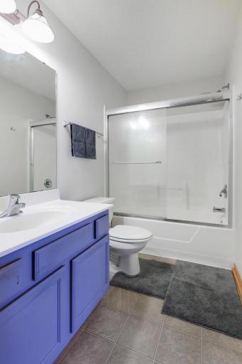 Full bath on upper level with access to hallway.