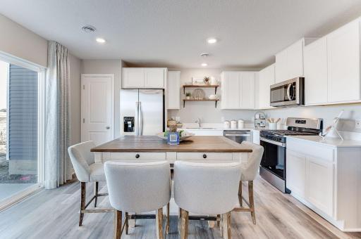 Lots of cabinets plus a full pantry gives you ample storage. Photo of model home, color & options will vary.
