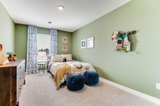 Another upper level bedroom. Photo of model home, color & options will vary.