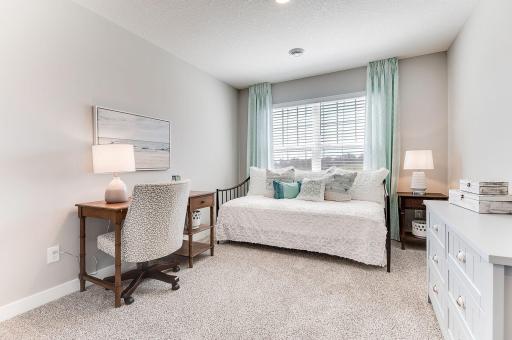 Yet another spacious upper level bedroom. Photo of model home, color & options will vary.