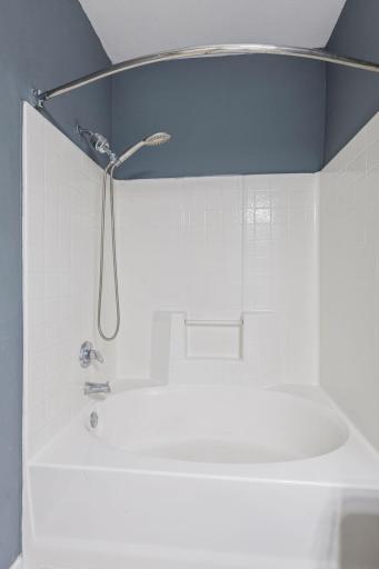 Full bath with newer vanity and clean finishes