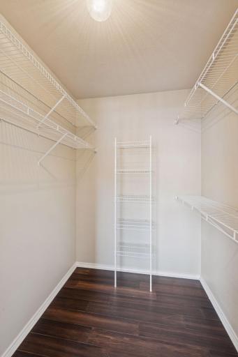 Spacious walk-in closet with motion sensor overhead lighting