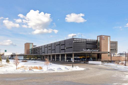 Southwest Metro Transit station adjacent to buildingâbus service now, light rail opening 2027