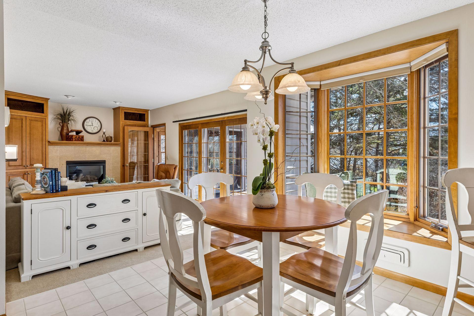 Sun-splashed informal dining opens to main floor family room