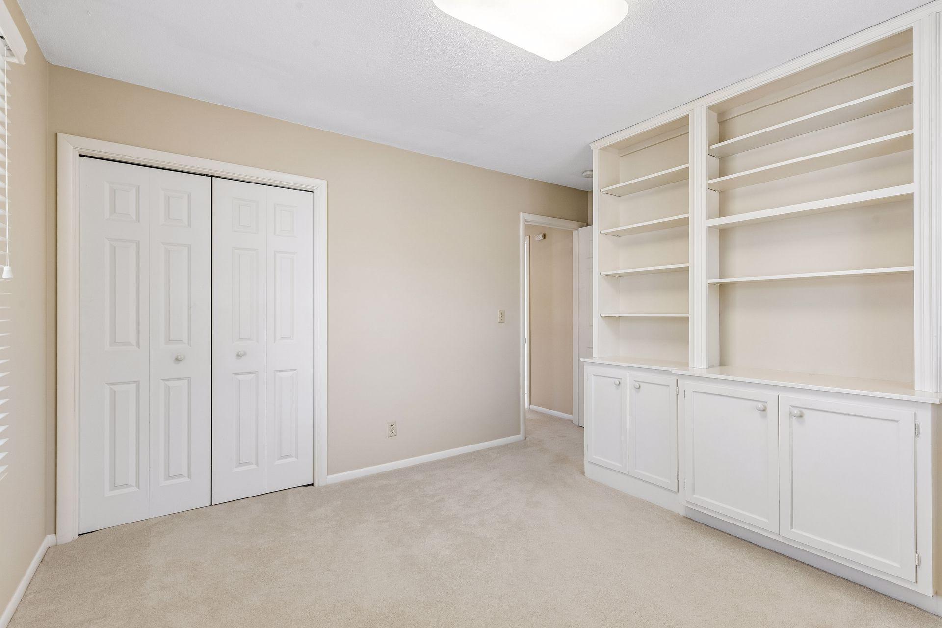 Third bedroom is highlighted by the terrific built-in book case.