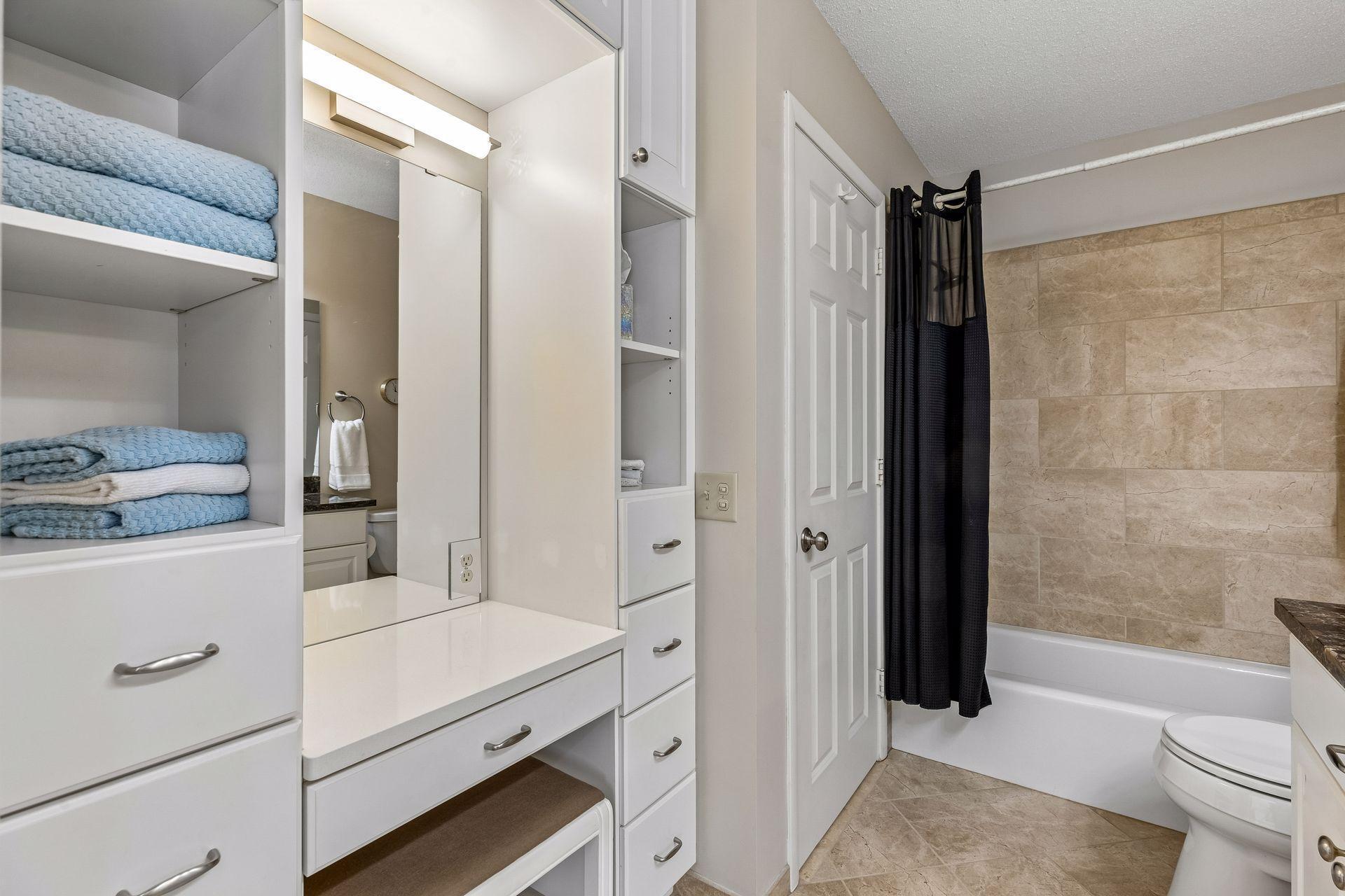 Upper level full bath has a terrific built in vanity