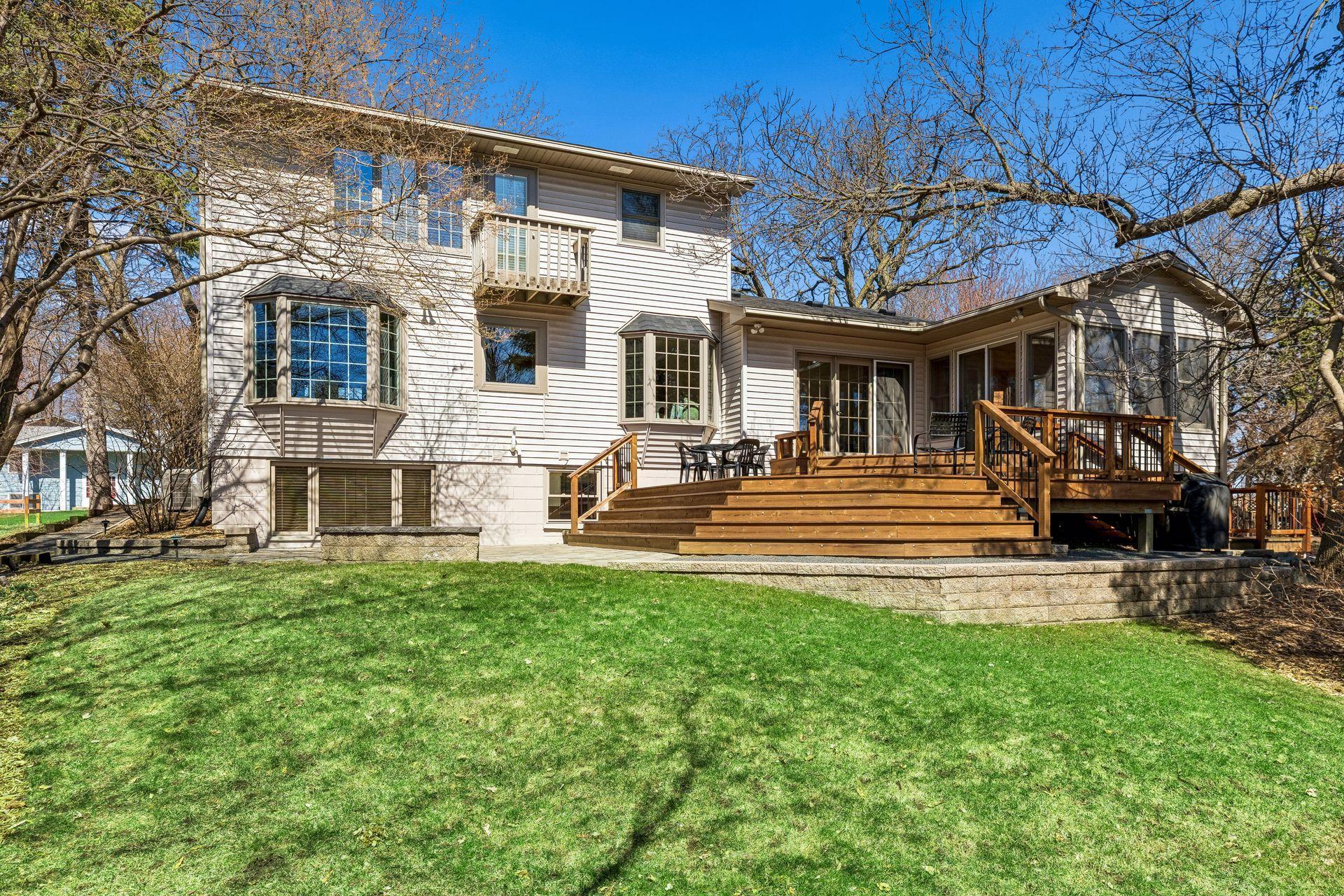 Pretty landscaped back yard with lighting