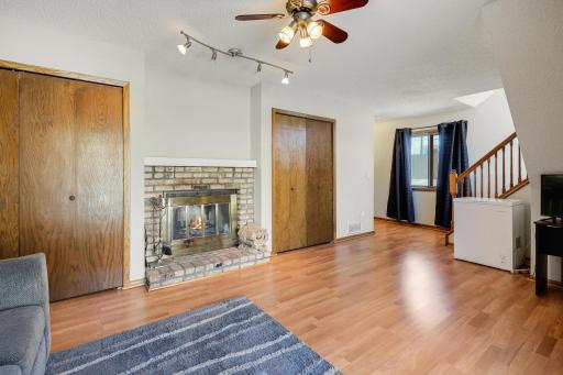 Cozy Up to This Brick Wood Burning Fireplace in Your Walkout Family Room