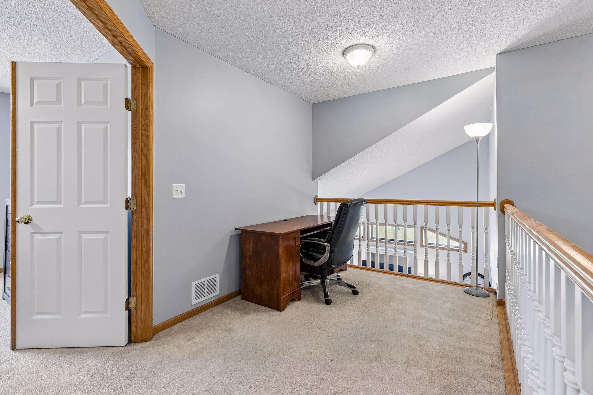 Upper level loft space making the perfect home office or reading nook!