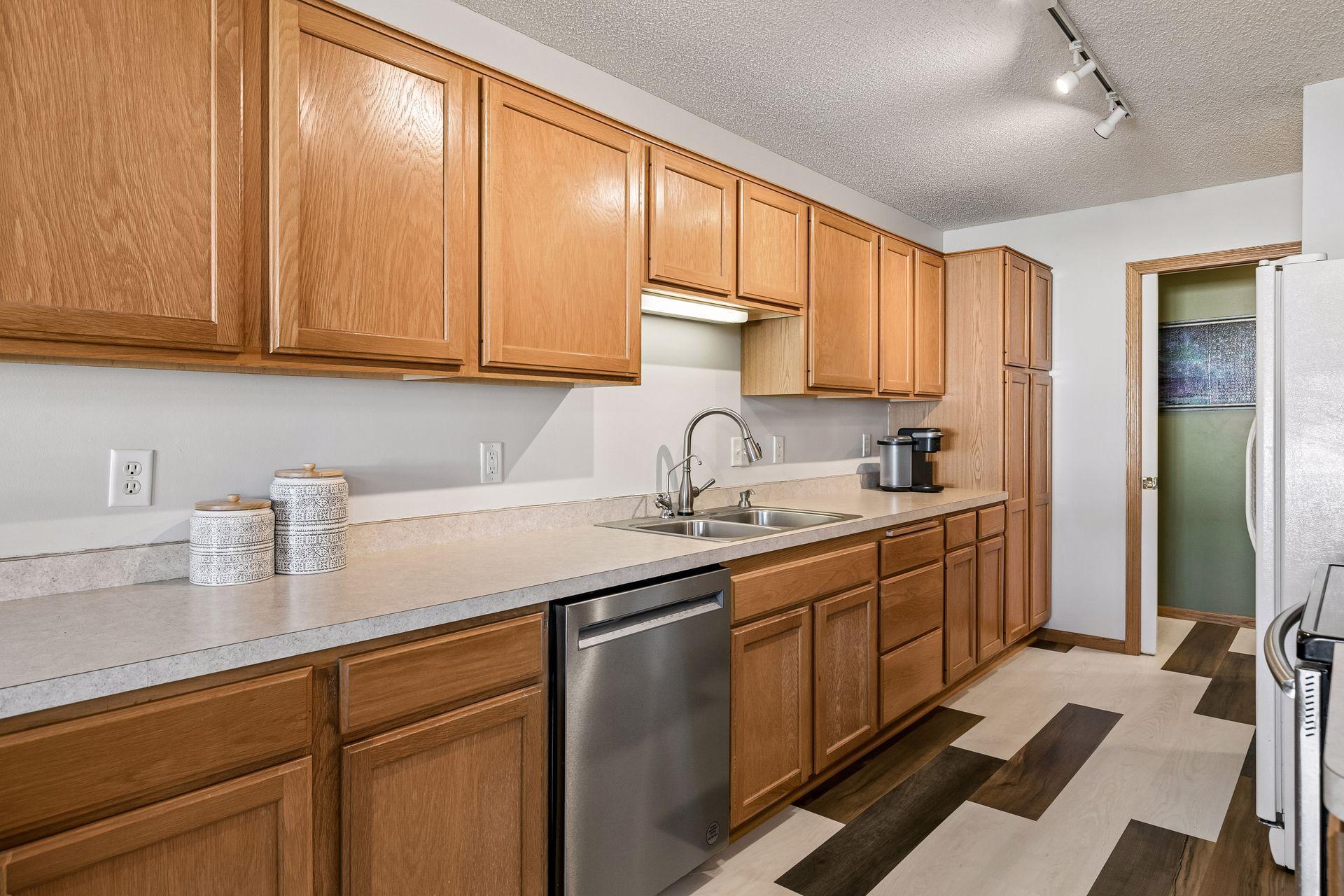 Enjoy the newer Kitchen Aid dishwasher & luxury vinyl plank flooring!