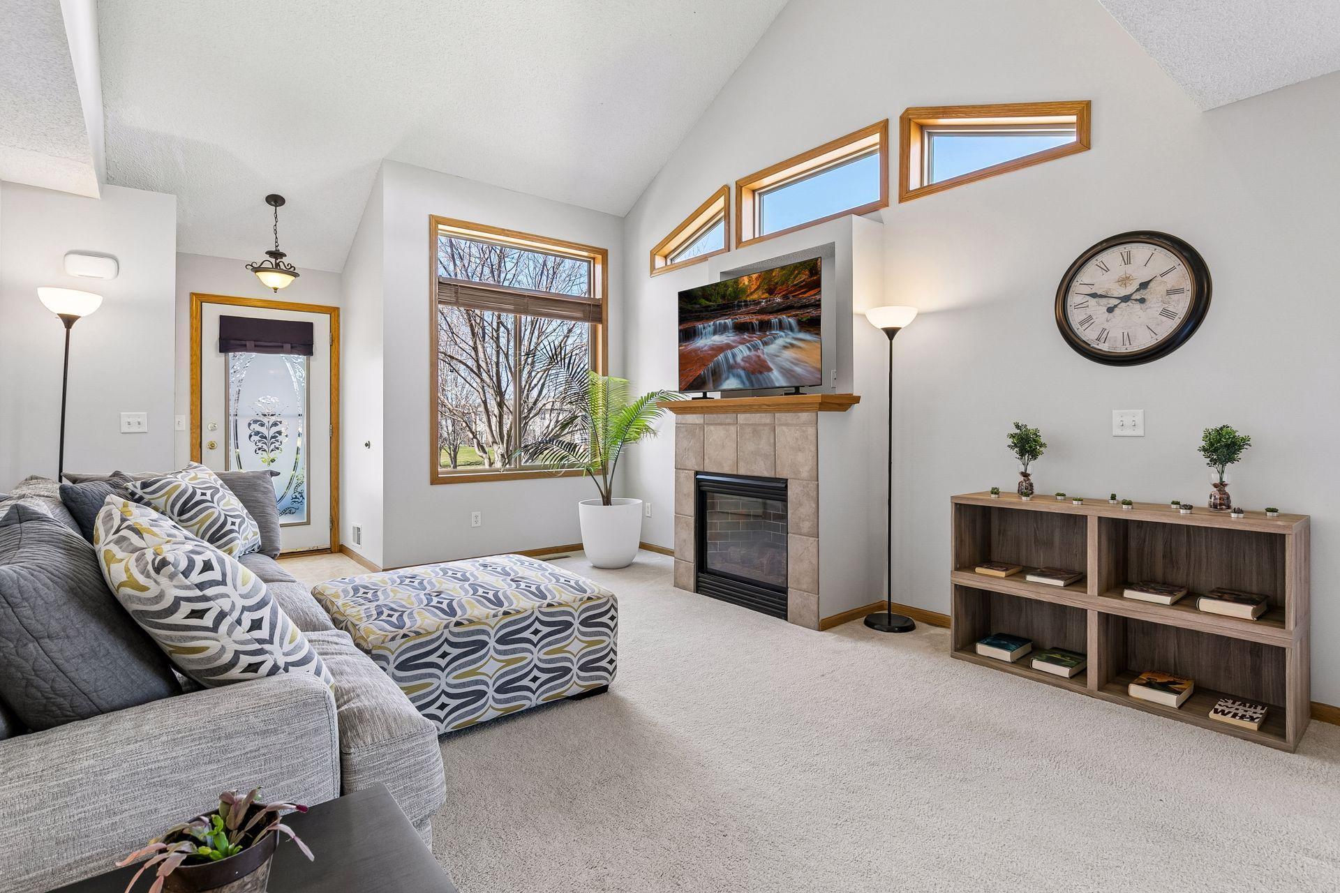 Vaulted ceiling & abundant windows in this inviting & spacious living room!