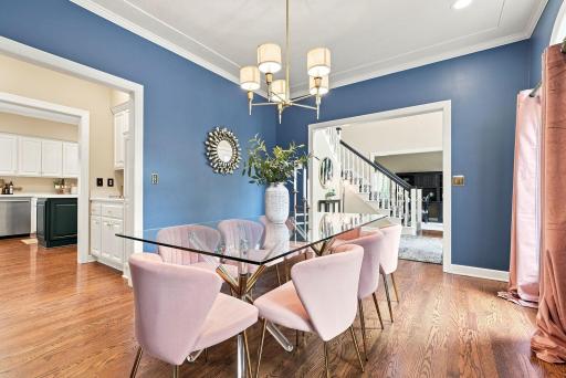 The formal dining room makes a bold statement with rich blue walls and easy access to the Butler's pantry and kitchen.