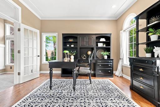 Showcasing symmetrical built-in cabinetry and abundant natural light from the adjacent window.