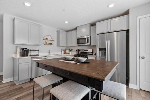 This spacious kitchen is sure to please the family chef! Photo is of model home. Colors and options may vary. Ask Sales Agent for details.