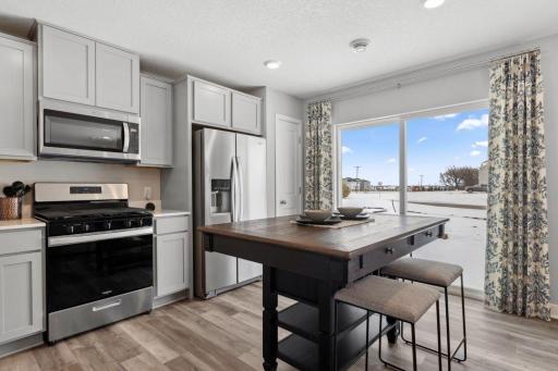 Lots of cabinets and pantry space will ensure that you have plenty of storage options. Photo is of model home. Colors and options may vary. Ask Sales Agent for details.
