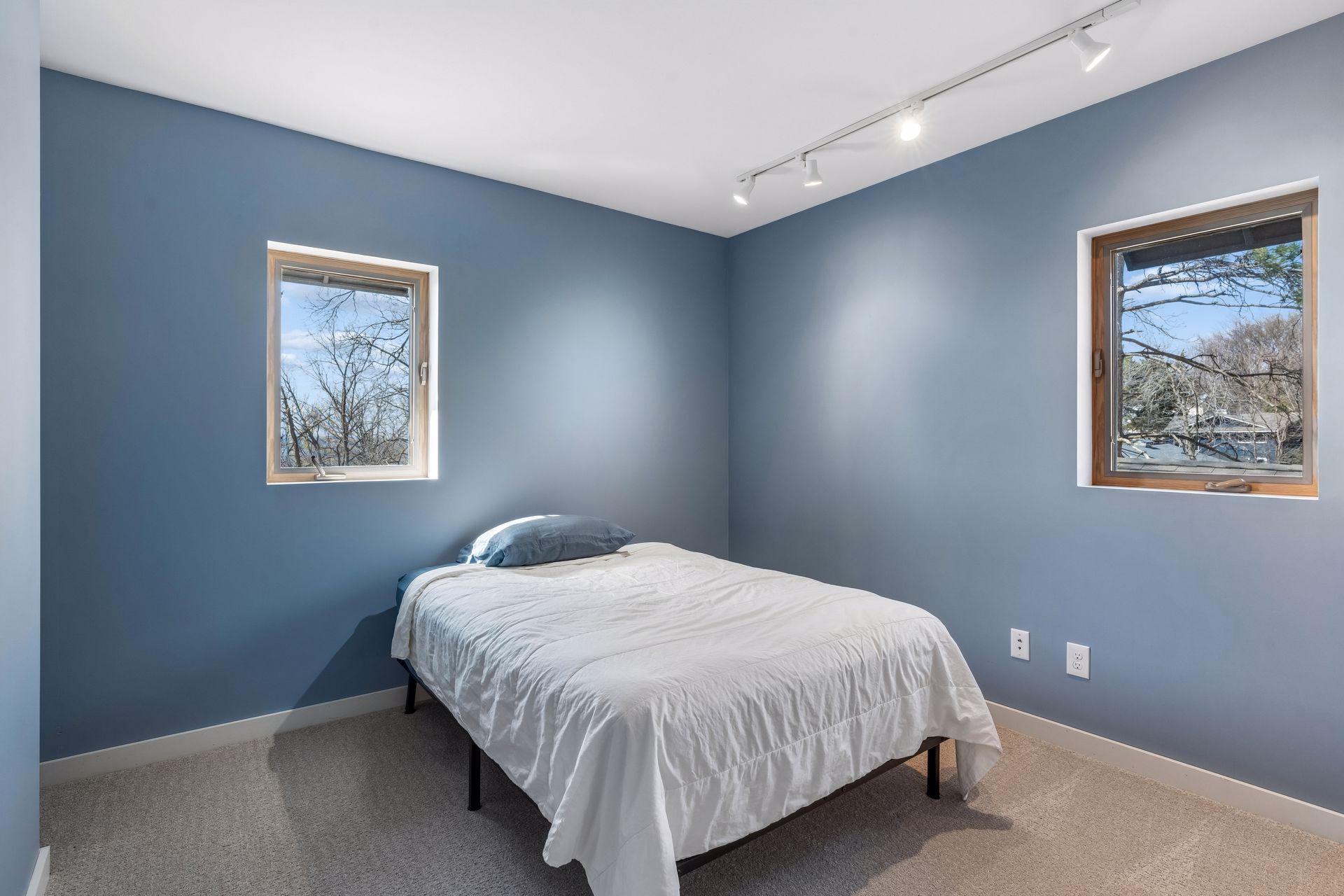 One of two upper level bedrooms - both with brand new carpet Feb 2026.