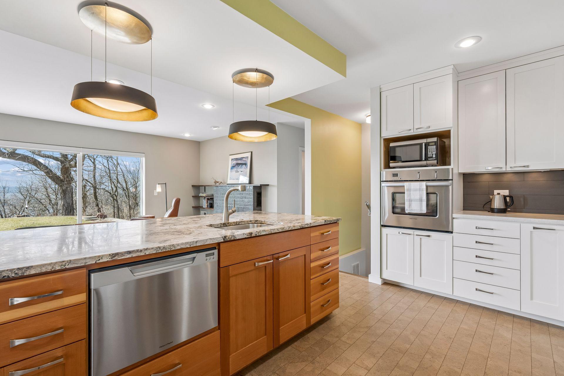 The granite peninsula features hard to find fine-grain pine wood cabinetry with extra deep drawers.