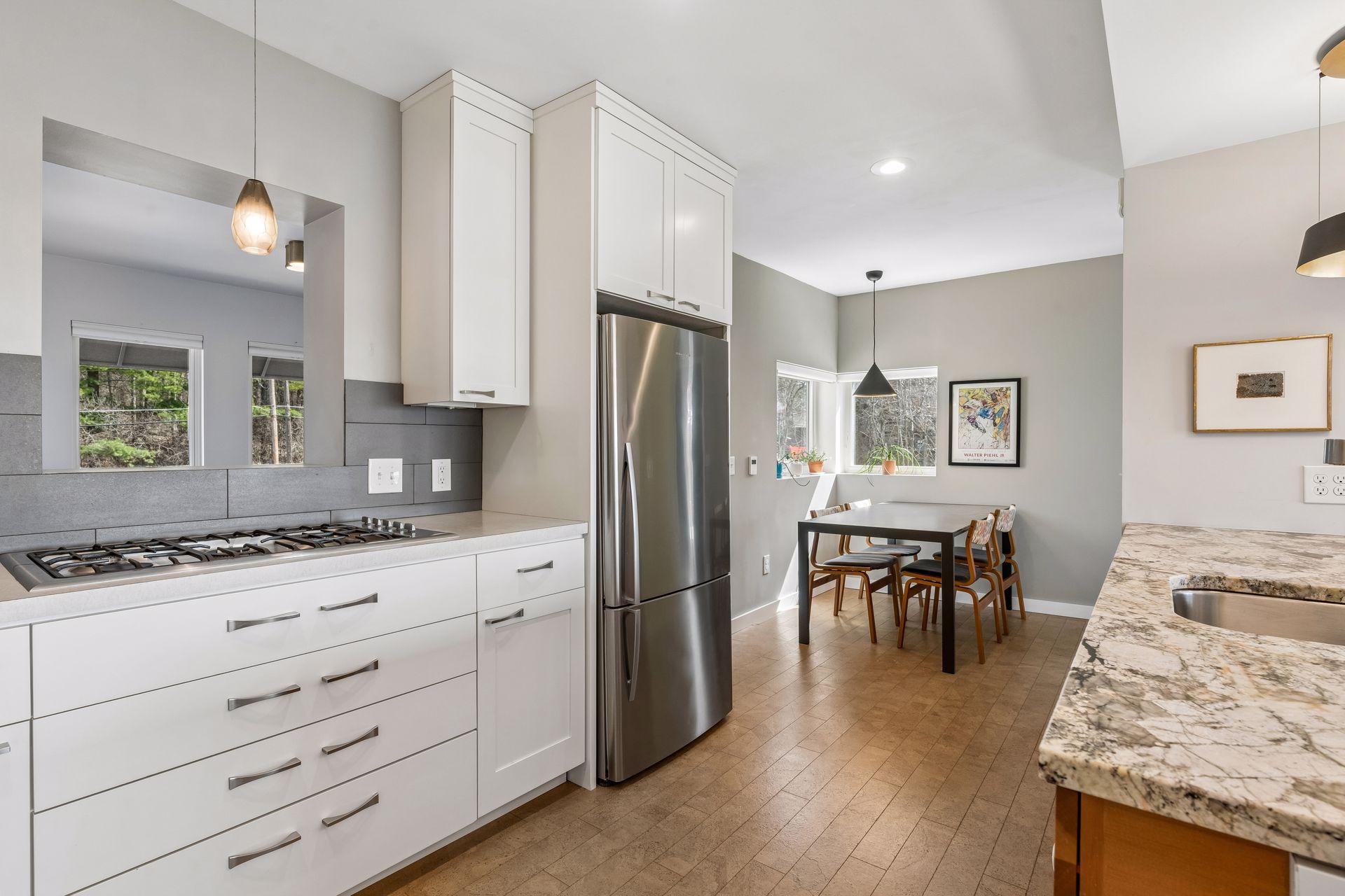 Dine at the breakfast bar or quaint dining nook with corner windows.
