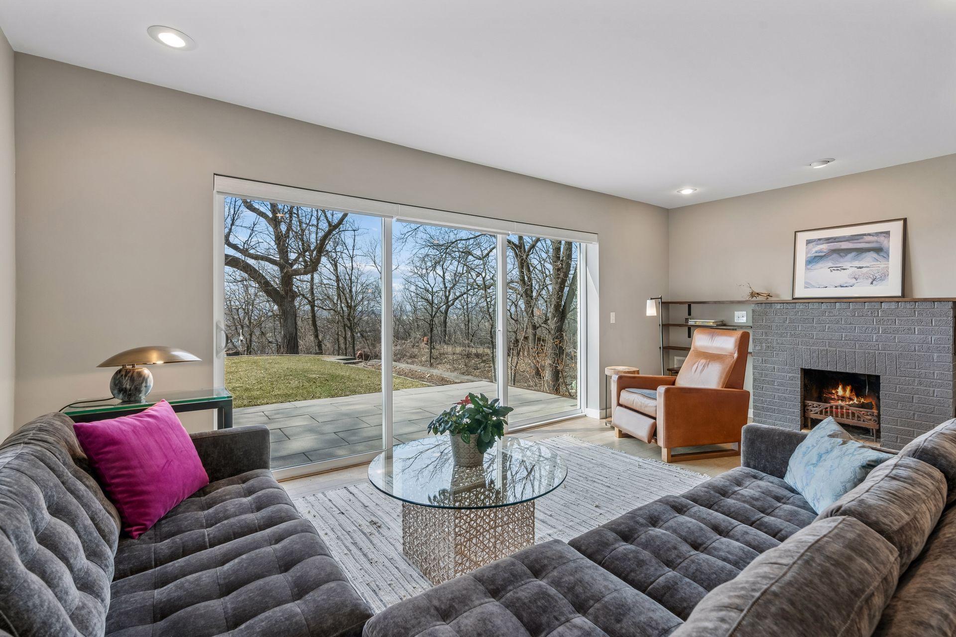 The multi-panel sliding glass door and the east living room window have remote controlled blinds.