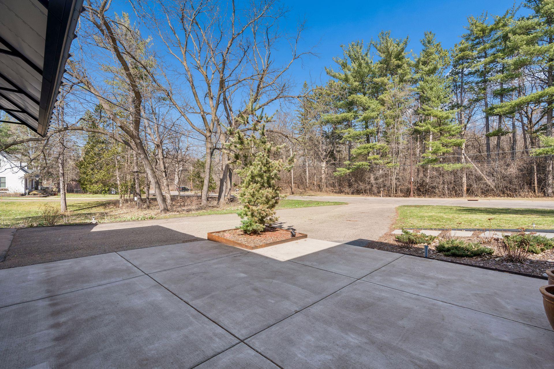 Large asphalt driveway plus a 2 car garage and no neighbors across the street - more natural woods and wildlife!