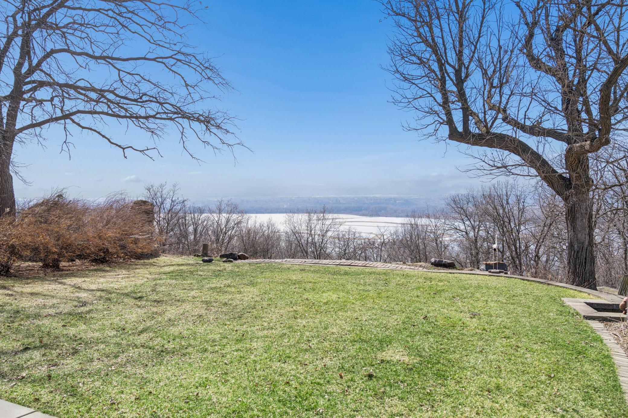 Manicured, level backyard with irrigation and retaining wall with steps to side yard. Installed sod & sprinkler system in 2012.. There’s also a drip system along top and bottom of retaining wall.