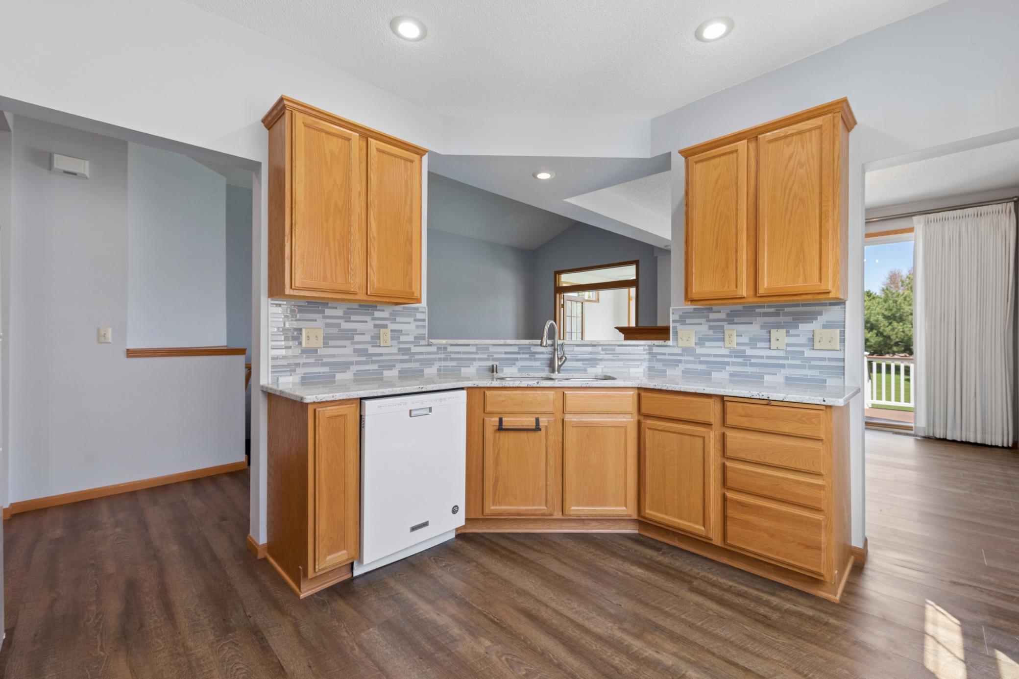 Updated kitchen with glass tile backsplash