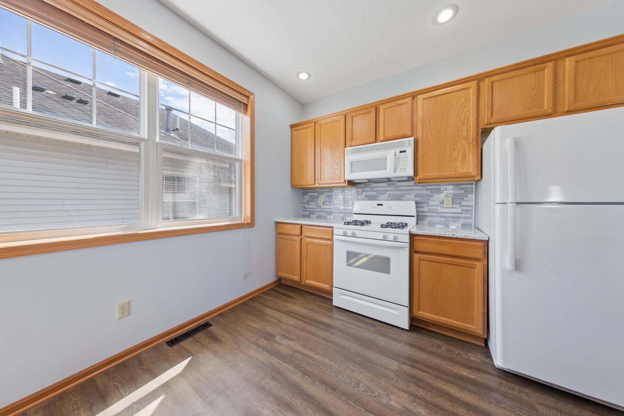 Bright sunny kitchen open to the living and dining rooms