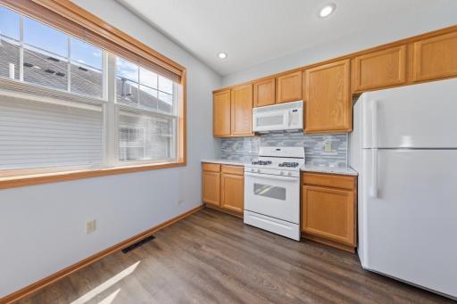 Bright sunny kitchen open to the living and dining rooms