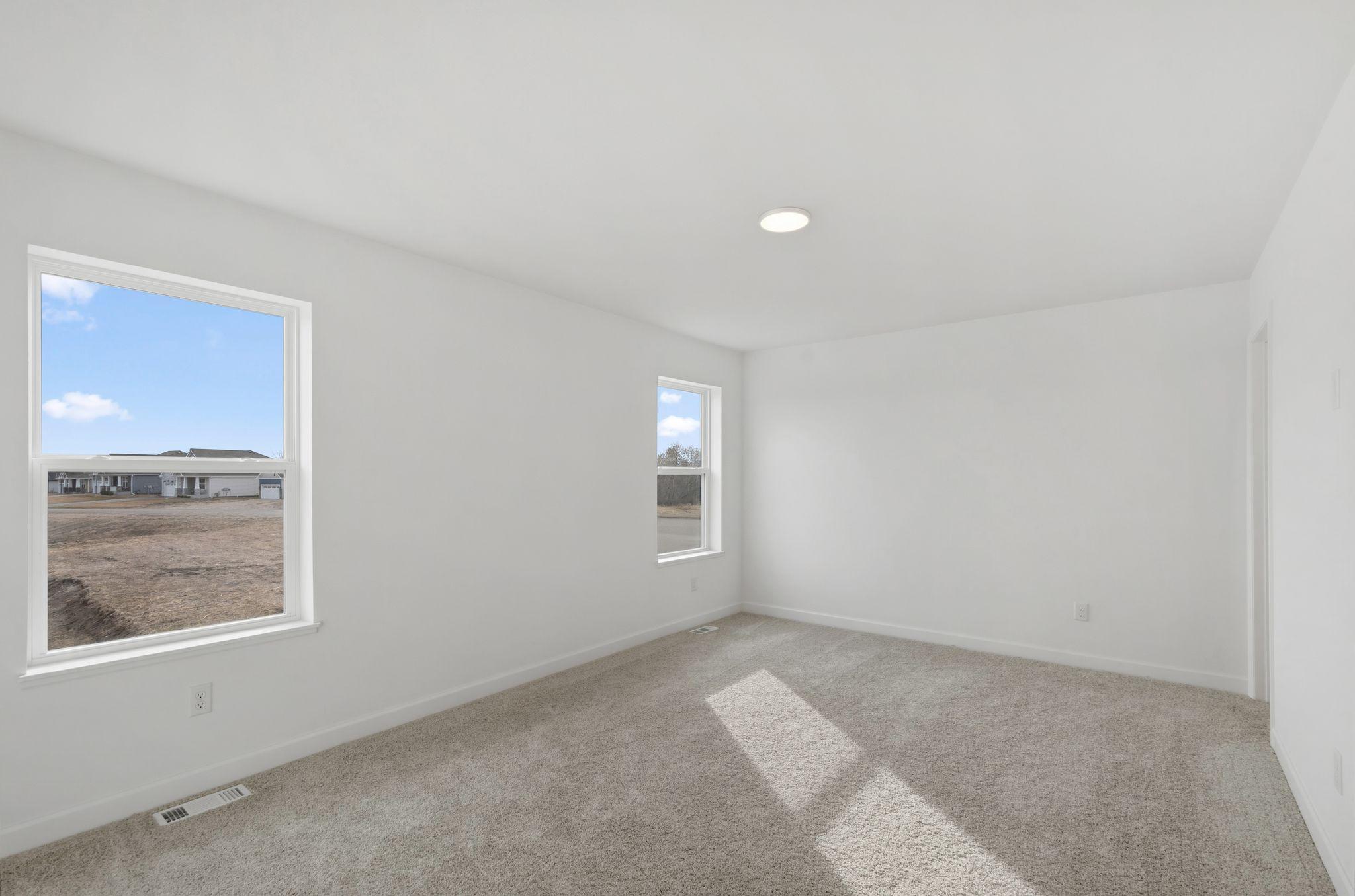 An expansive owner’s suite offers residents a restful bedroom, walk-in closet and en-suite bathroom for optimal privacy and comfort.