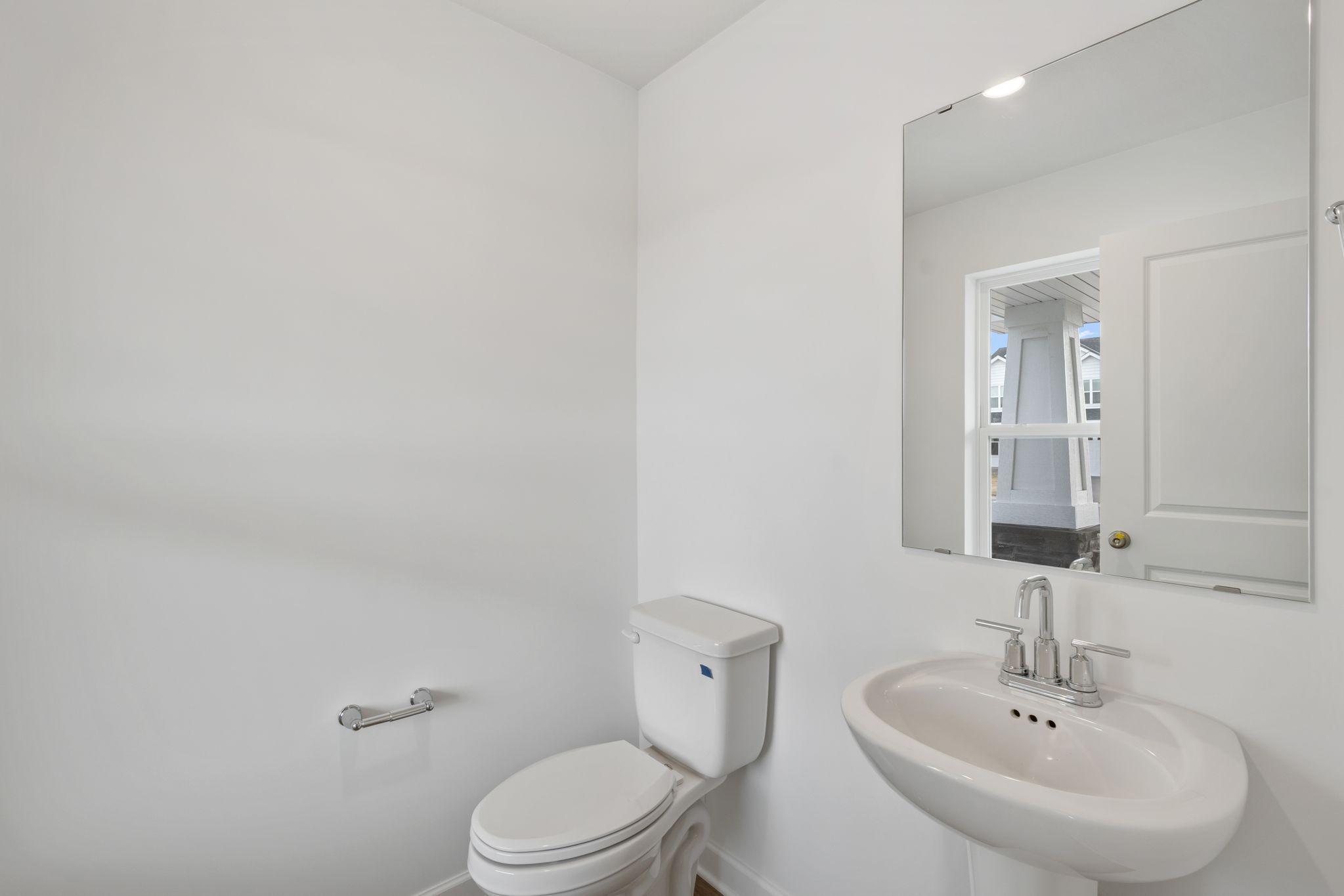 This powder room is located near the front of the home