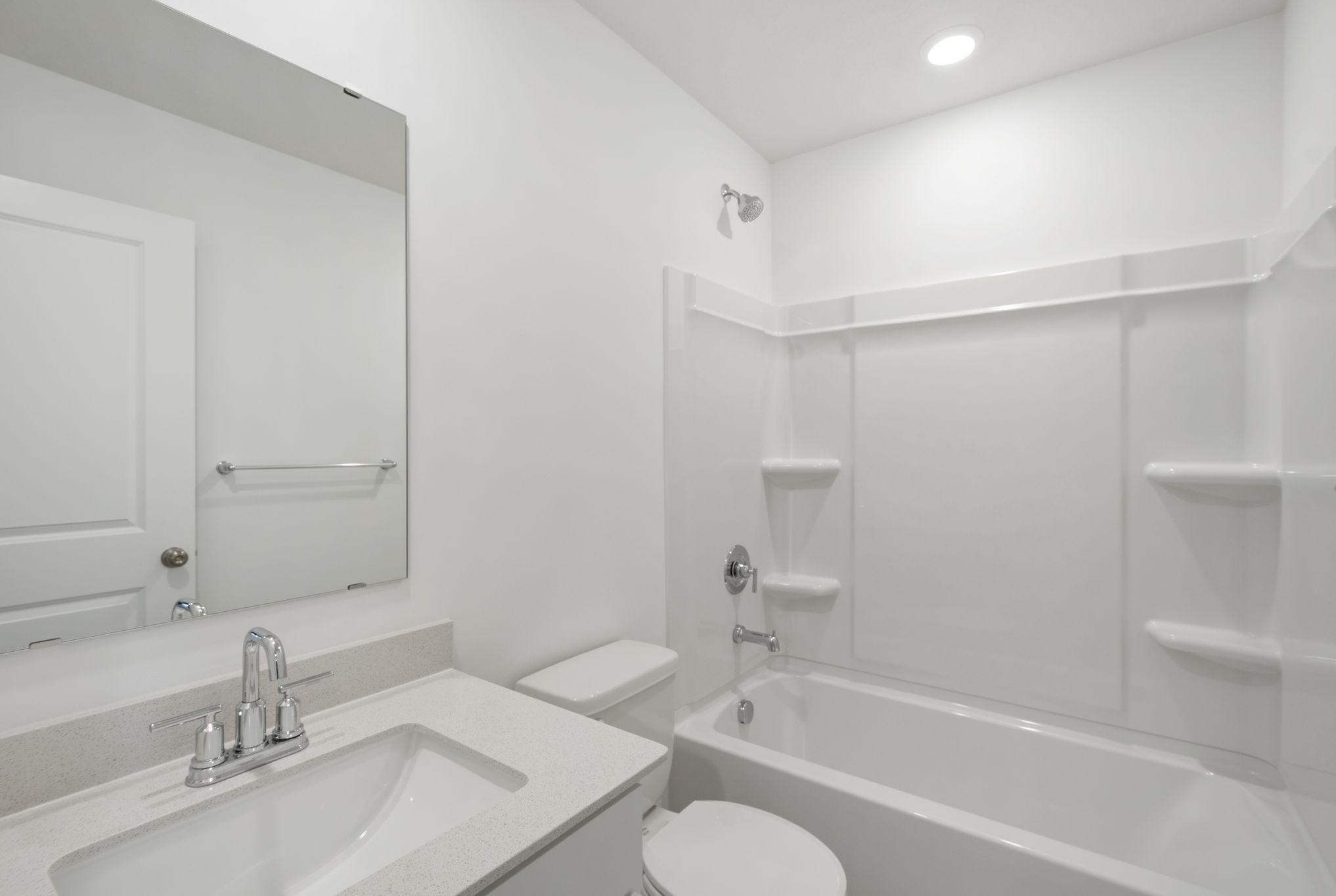 A full bathroom on the lower level offers greater convenience, perfect for long-term guests