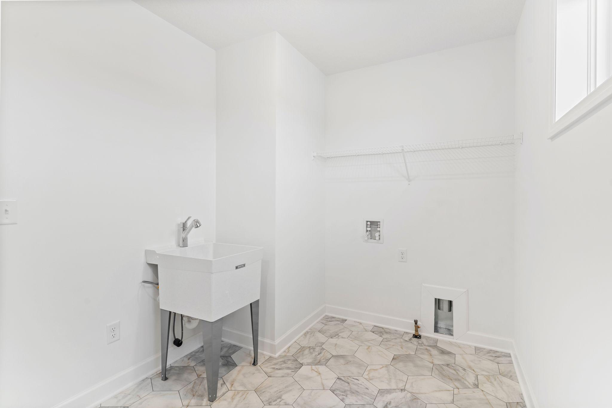 Located on the same floor as all the bedrooms is a spacious laundry room to conduct daily chores and organizational tasks