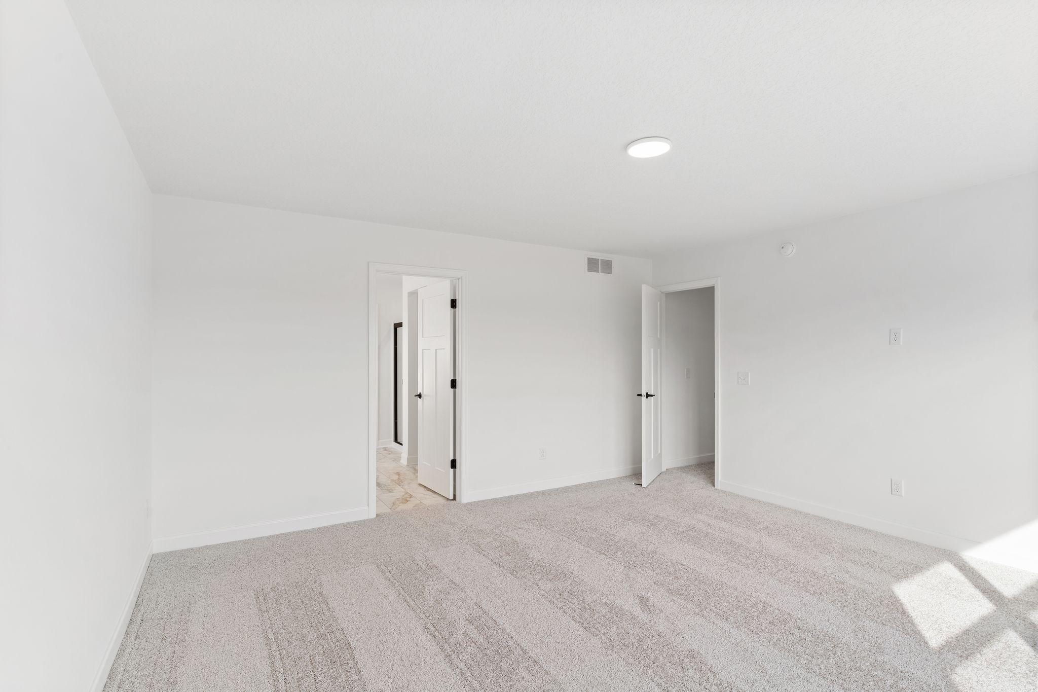 This elegant bathroom has direct access to the walk-in closet, perfect for getting ready throughout the week