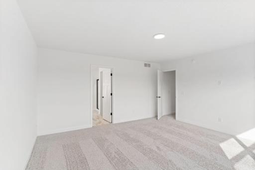 This elegant bathroom has direct access to the walk-in closet, perfect for getting ready throughout the week