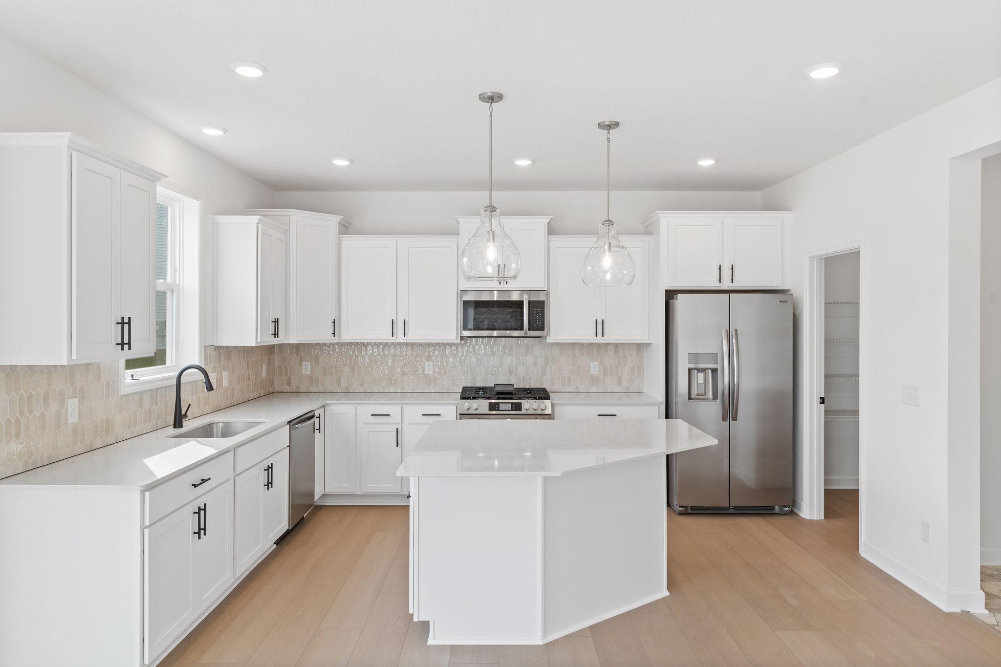 The kitchen naturally operates as the heart of this home, offering ample countertop space and brand-new appliances that will inspire attempts at new recipes.