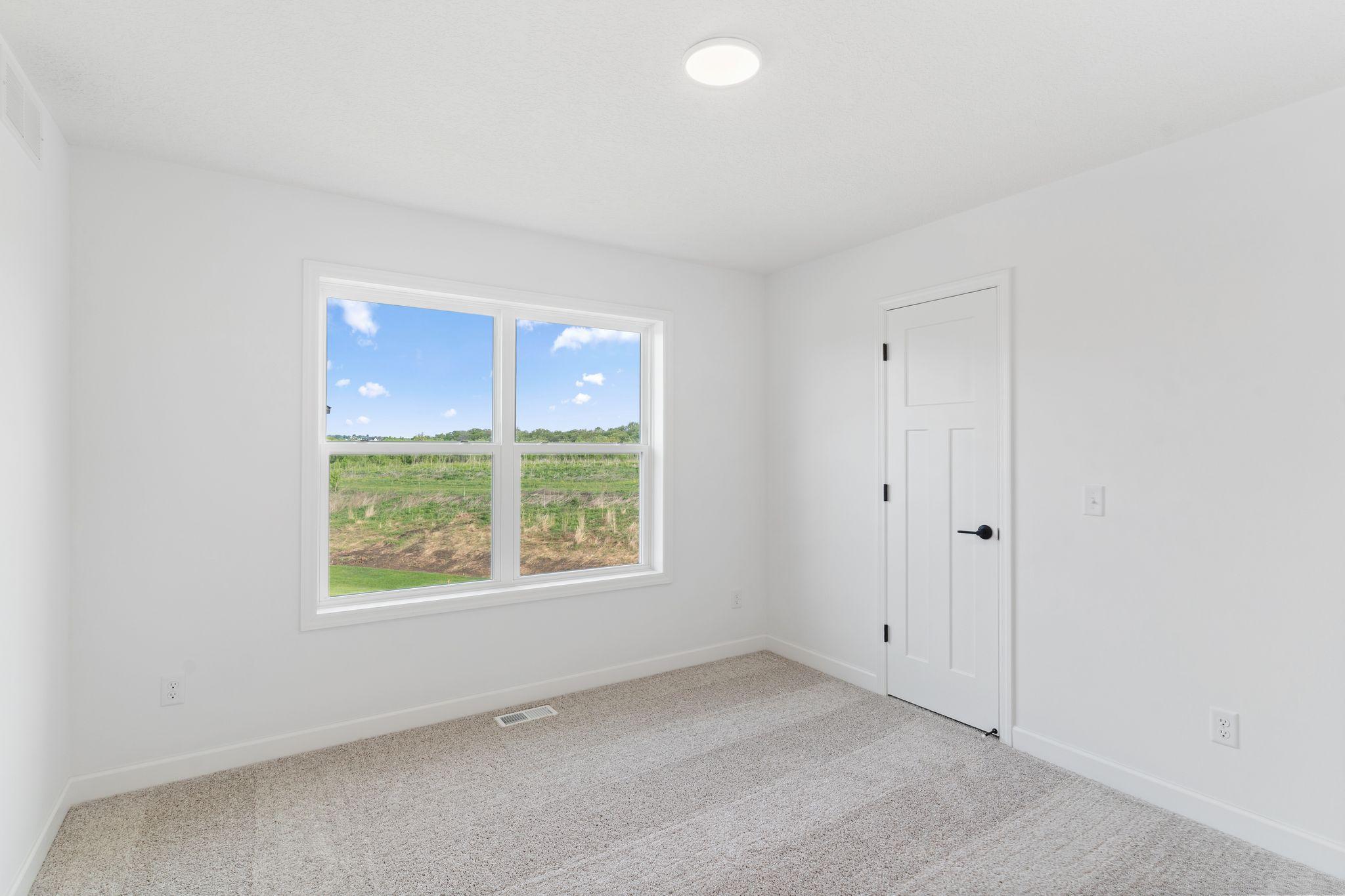 The secondary bedrooms provide spacious and private retreats for household members or overnight guests.
