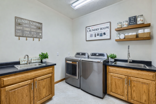 Main floor laundry room w/2 stainless sinks