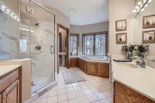 2nd Floor Primary Bathroom with jacuzzi tub and updated shower